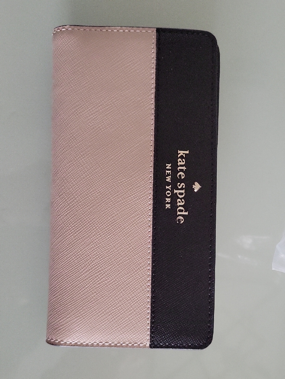 kate spade Large Slim wallet in Warm Beige and black with gold logo